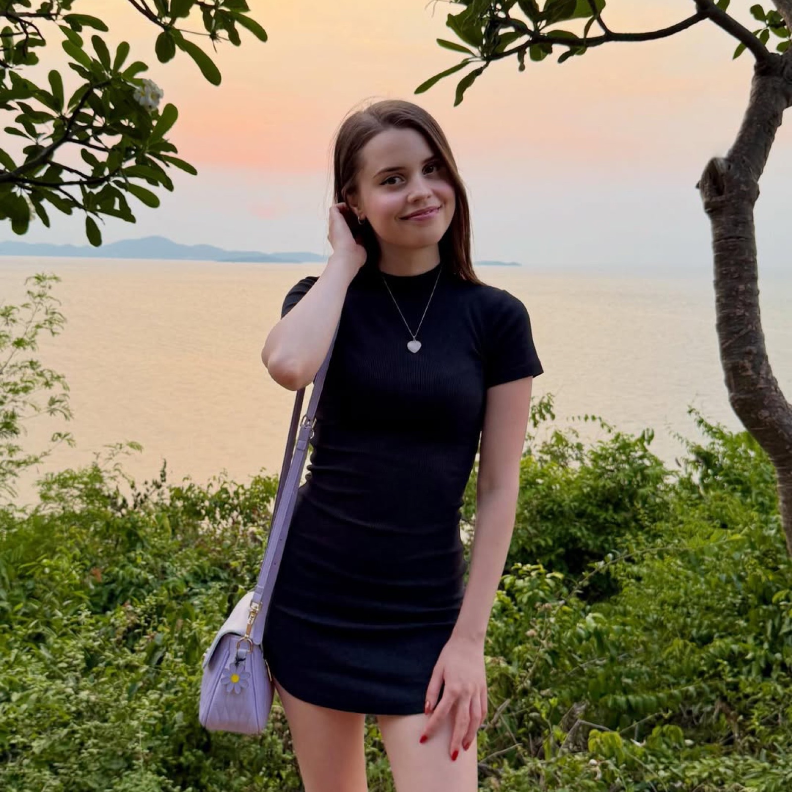 Jamie Young overlooking the sea at sunset