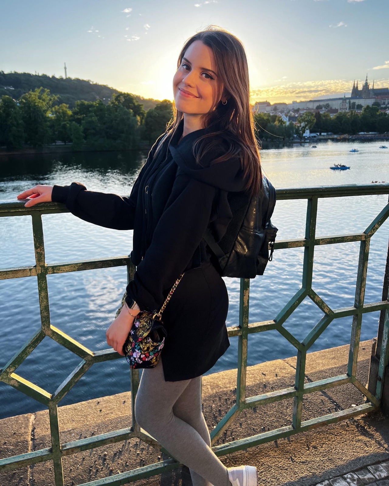 Jamie Young on a bridge in Prague at golden hour
